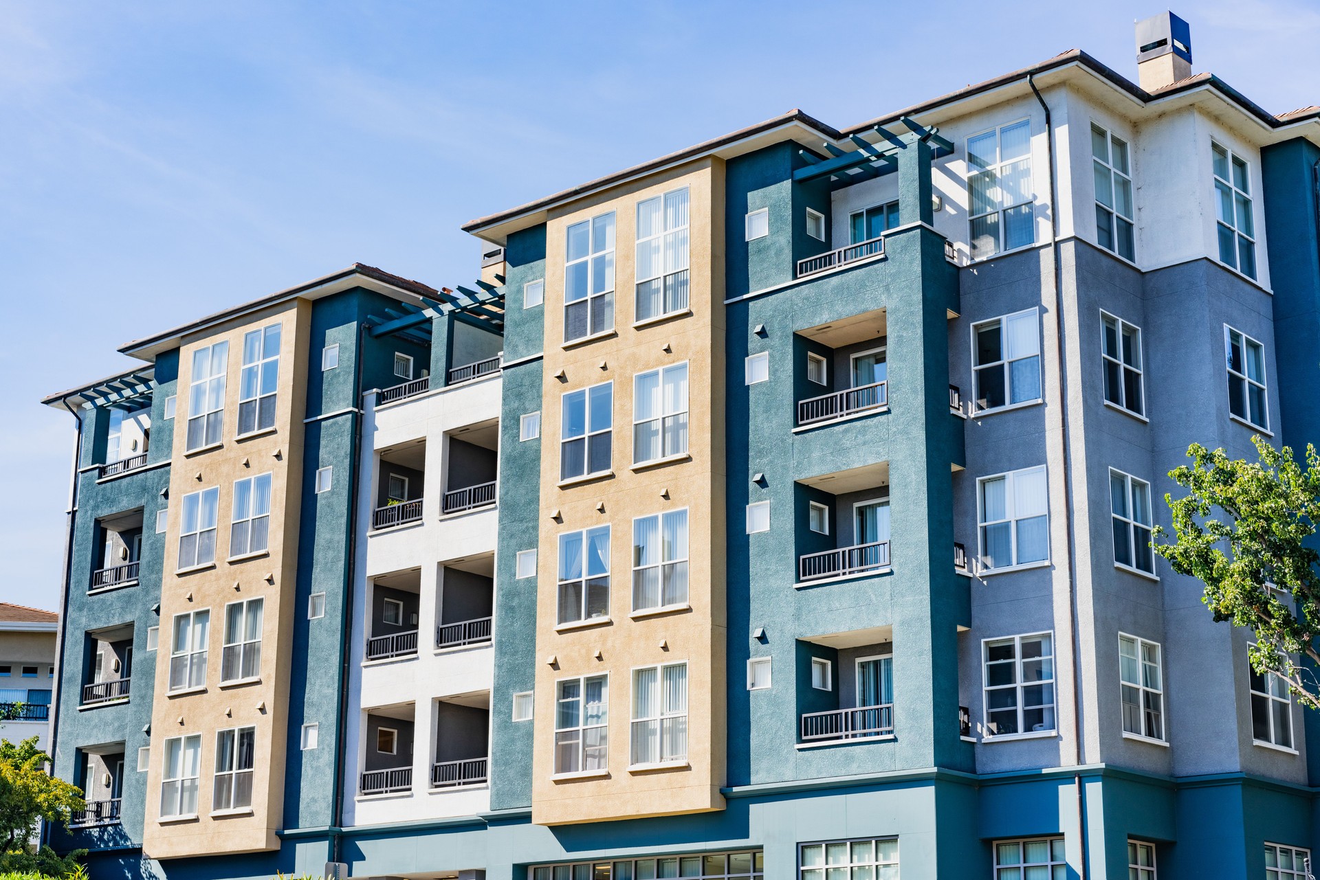 Exterior view of modern apartment building offering luxury rental units in Silicon Valley; Sunnyvale, San Francisco bay area, California